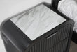 Beckett nightstand close-up showing the white marble-look top and side speaker