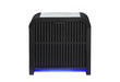 Front view of the black Beckett cooler nightstand with fluted panels and blue lighting