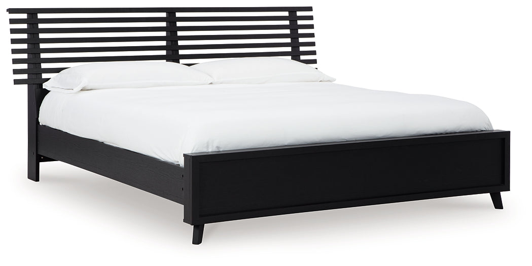 Danziar King Panel Bed with Mirrored Dresser, Chest and Nightstand - Raleigh Outlet