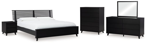 Danziar King Panel Bed with Mirrored Dresser, Chest and Nightstand - Raleigh Outlet