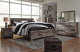 Derekson King Panel Bed with Mirrored Dresser, Chest and Nightstand - alternate view 11